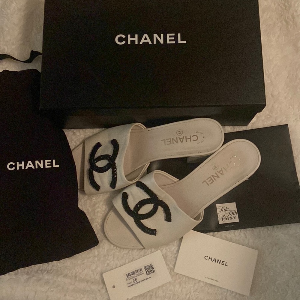 Chanel’s white mules sandals
